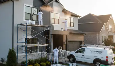Professional house painters working on exterior home in Cherry Hill, NJ